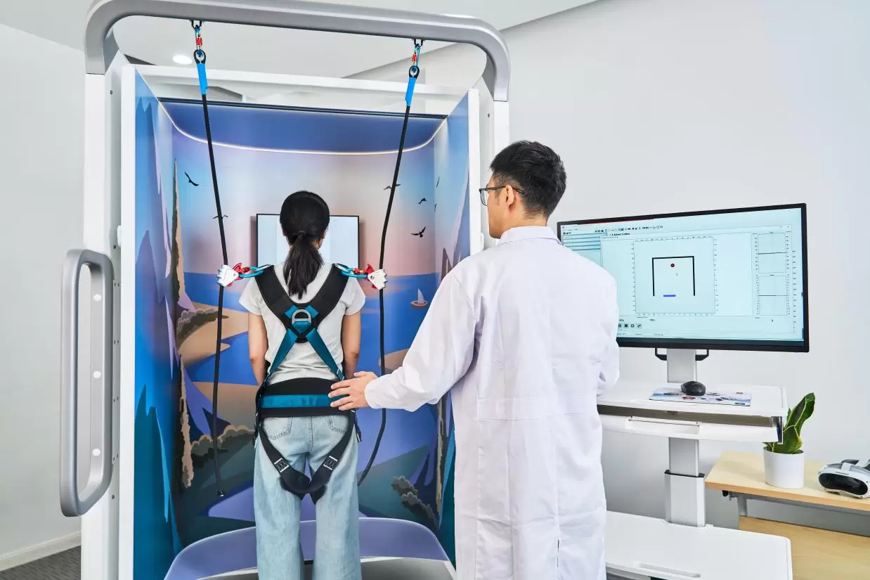 Patient performing balance rehabilitation training on a Computerized Dynamic Posturography system